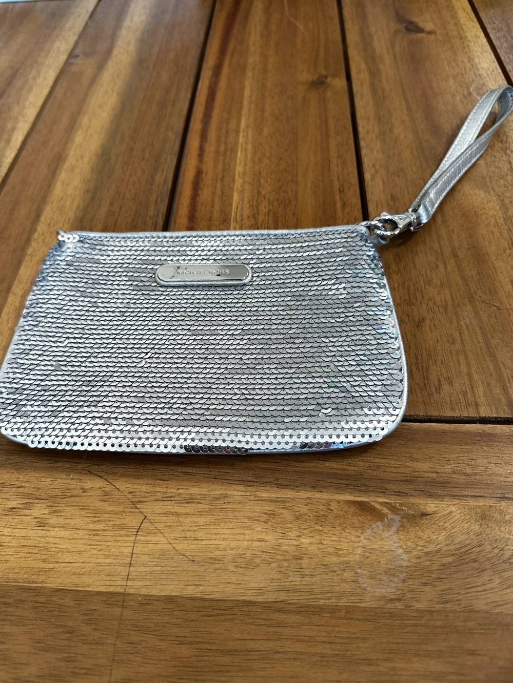 Michael Kors silver metallic wristlet with cardholder slots